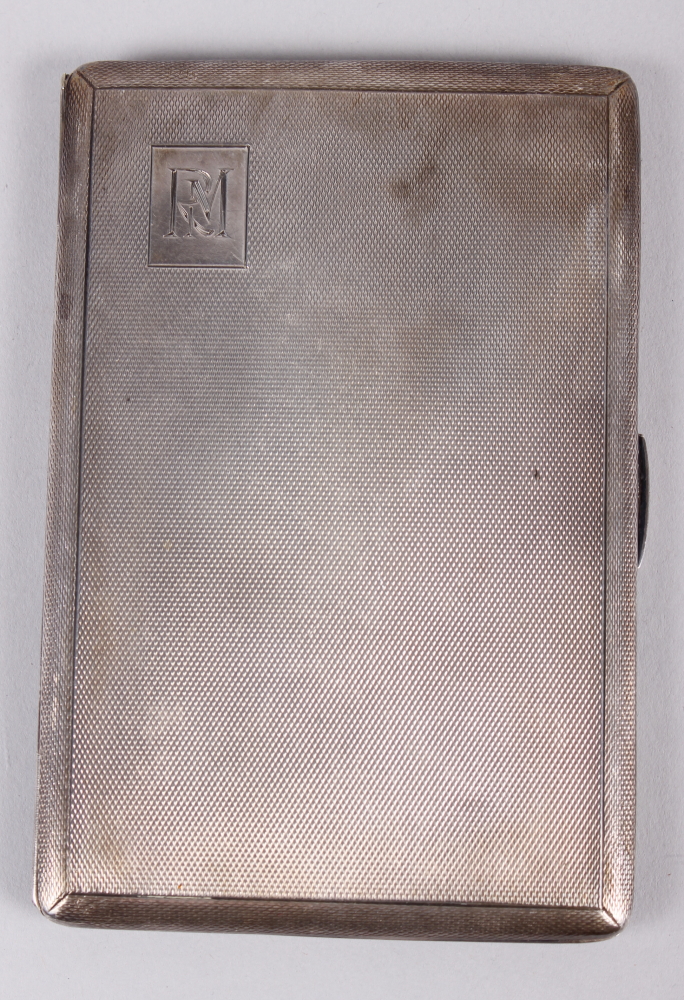 A silver cigarette case with engine turned decoration, 4.8oz troy approx