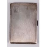 A silver cigarette case with engine turned decoration, 4.8oz troy approx