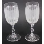 A pair of 1930s etched glass goblets with cut glass stems, 7 1/2" high