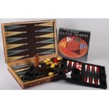 An Hermes leather bridge card case, a Smythson backgammon set (slight damages), a backgammon set, in