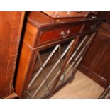 A mahogany display cabinet, fitted two drawers over lattice glazed doors, 48" wide x 14" deep x