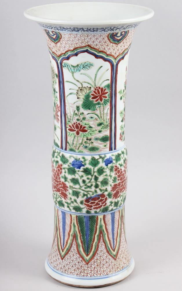 A Chinese gu vase with panels decorated trees and flowers, 16 1/2" high