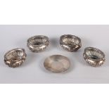 Four oval silver salts with spiral fluted decoration and a circular silver pin dish, 6.2oz troy