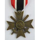 A WWII German War Medal Cross 2nd Class dated 1939, with ribbon.