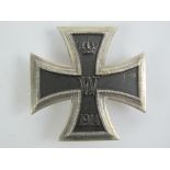 A reproduction WWI Imperial German Iron Cross 1st Class award pin badge dated 1914.