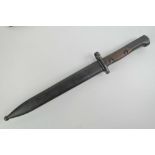 A Belgian FN 48 self loading rifle fighting knife style double edged blade in scabbard.