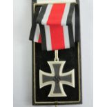 A reproduction WWII German Iron Cross award medal in presentation box with ribbon and within paper