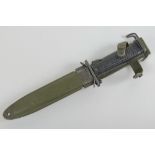 A US Military Korean War era M1 Carbine M5A1 bayonet/fighting knife in M8A1 scabbard with hanger.