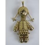 A 925 silver gold plated large pendant in the form of a female 'rag doll' set with red and white