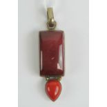 A large silver and red hard stone pendant, stamped 925,6.5cm in length inc bale.