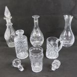 Three assorted decanters with stoppers, together with a carafe and two cut glass pints,