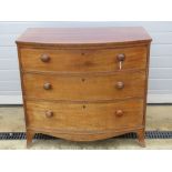 A late Victorian bow fronted chest of three drawers raised on outswept feet, 100cm wide.