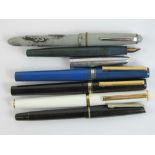Five vintage Osmiroid fountain pens with yellow metal nibs,