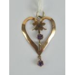 A 9ct gold Edwardian heart shaped pendant having two round amethyst cabachons upon, stamped 9ct, 3.