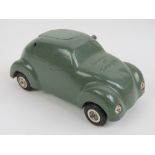 A vintage novelty table lighter made in Germany in the form of an early Volkswagen Beetle and