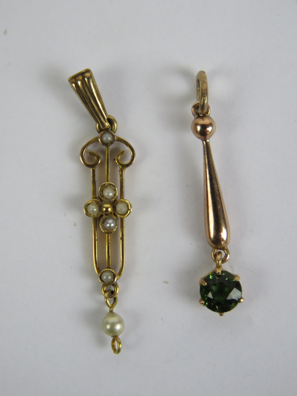 A 9ct gold art nouveau pendant having seed pearls upon, stamped 9ct, drop deficient, 3.