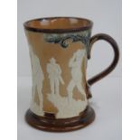 A Doulton Lambeth tankard having applied vintage golfing scenes upon, No 170 to the base, 16cm high,