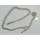 A HM silver guard chain having single clasp, T-bar and two coins upon. 45cm in length, 1.3ozt.