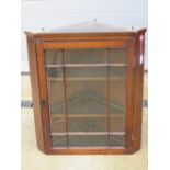 A glazed hanging corner cabinet c1900, 67cm wide.