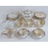 A late 18th century tea set comprising teapot and stand, milk jug and sugar, eight cups,