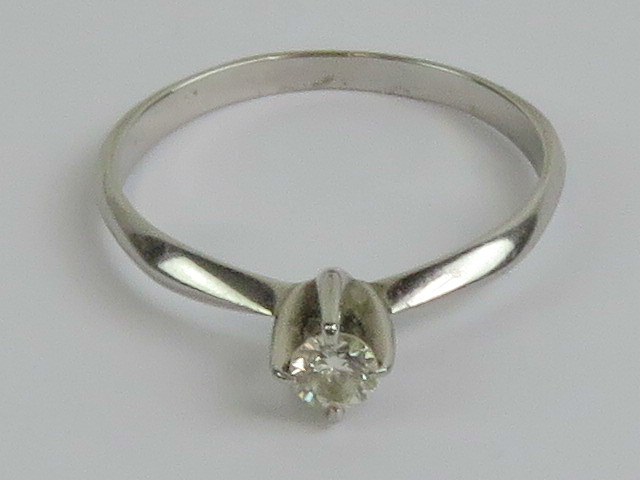 An 18ct white gold and diamond solitaire ring,