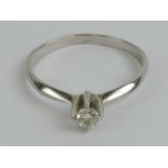 An 18ct white gold and diamond solitaire ring,