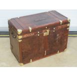 A fine leather covered travel trunk,