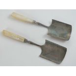 A fine pair of mother of pearl handled stilton scoops each measuring 25cm in length.