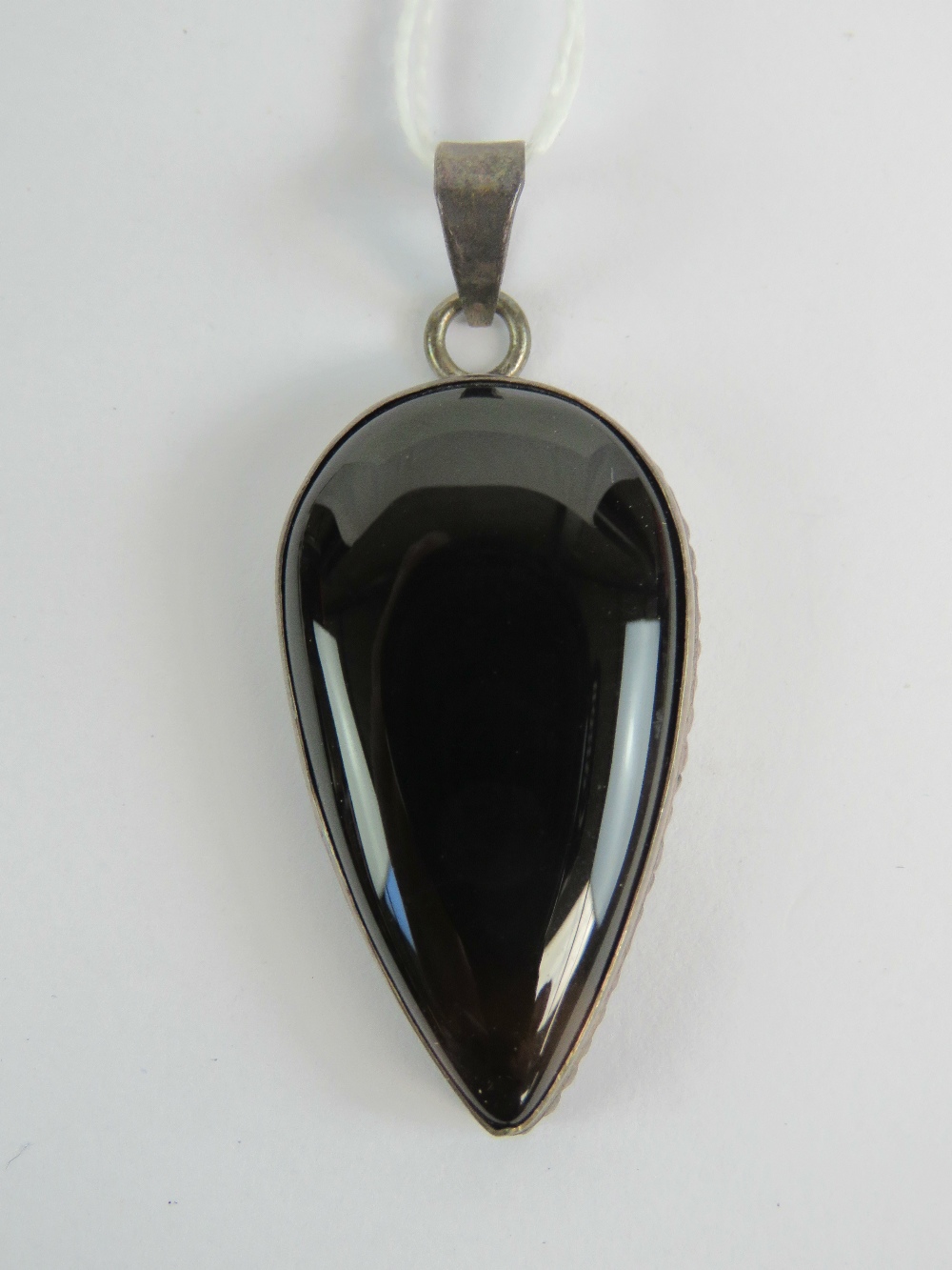 A large silver and hard stone teardrop shaped pendant, stamped 925, 5.5cm in length inc bale.