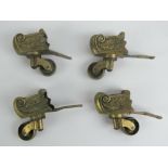 A set of four good cast brass table castors.