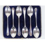 A set of six HM silver teaspoons made by Walker & Hall having golf club motif to terminal and