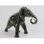 A ceramic Indian Bull Elephant, 26cm high, 37cm in length, no makers mark.