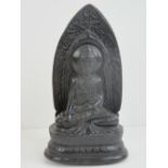 A 19th century carved temple or shrine Buddha figurine, blind carved lignum throughout, 20cm high.