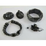 A collection of Victorian and later pieces of jewellery including a two Whitby jet brooches,