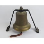 A bell from a Green Goddess fire engine marked ER with crown over, with cradle and leather handle,