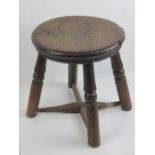 A circular elm seated cut down 19th century stool. Provenance: Sadington Hall, Leicestershire.