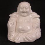 A 20th century creamware Buddha figurine, sitting 12cm high.