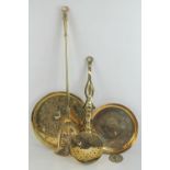 A pierced lidded brass chestnut roaster, 58cm in length, together with two brass trays,