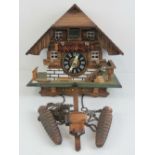 A 20thC traditional style cuckoo clock in the form of a Swiss chalet,.