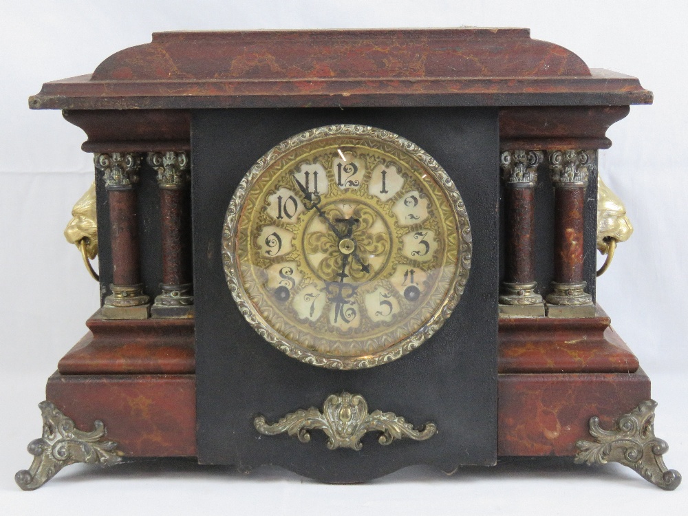 An eight day striking faux marble Continental style 'poor mans' clock having Arabic numerals and