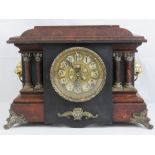 An eight day striking faux marble Continental style 'poor mans' clock having Arabic numerals and