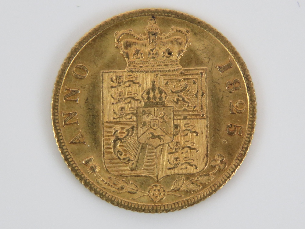 A 22ct gold George III 1825 half sovereign, 4g, in protective plastic pod. - Image 2 of 2