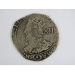 A Charles I Shilling minted at the Tower Mint under Parliament (the mintmark in the reverse being a