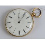 An 18ct gold open face pocket watch having horse engraving to back, case back stamped 18k a/f,