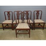 A set of five (4 + 1) mahogany framed dining chairs having matching drop in seats.