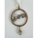 A delightful 9ct gold aquamarine pendant having circular frame with three round cut aquamarines set