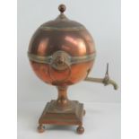 A 19th century copper and brass samovar with tap.