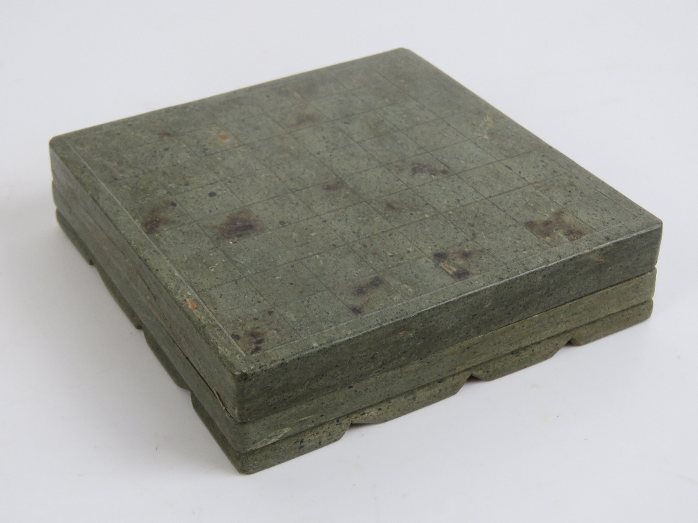 A 20th century Oriental carved stone miniature chess set in case, 10cm square. - Image 5 of 5