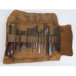 An interesting estate wood workers leather tool roll opening to reveal vintage 'Holtzapffel & Co'