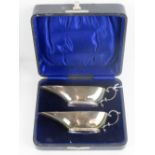 A fine pair of HM silver sauce boats complete with original fitted case, hallmarked Birmingham 1911,